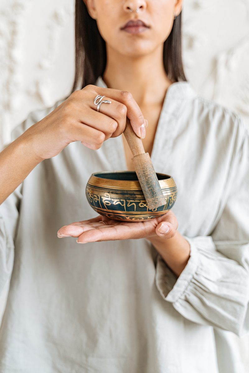 A Person Holding a Singing Bowl